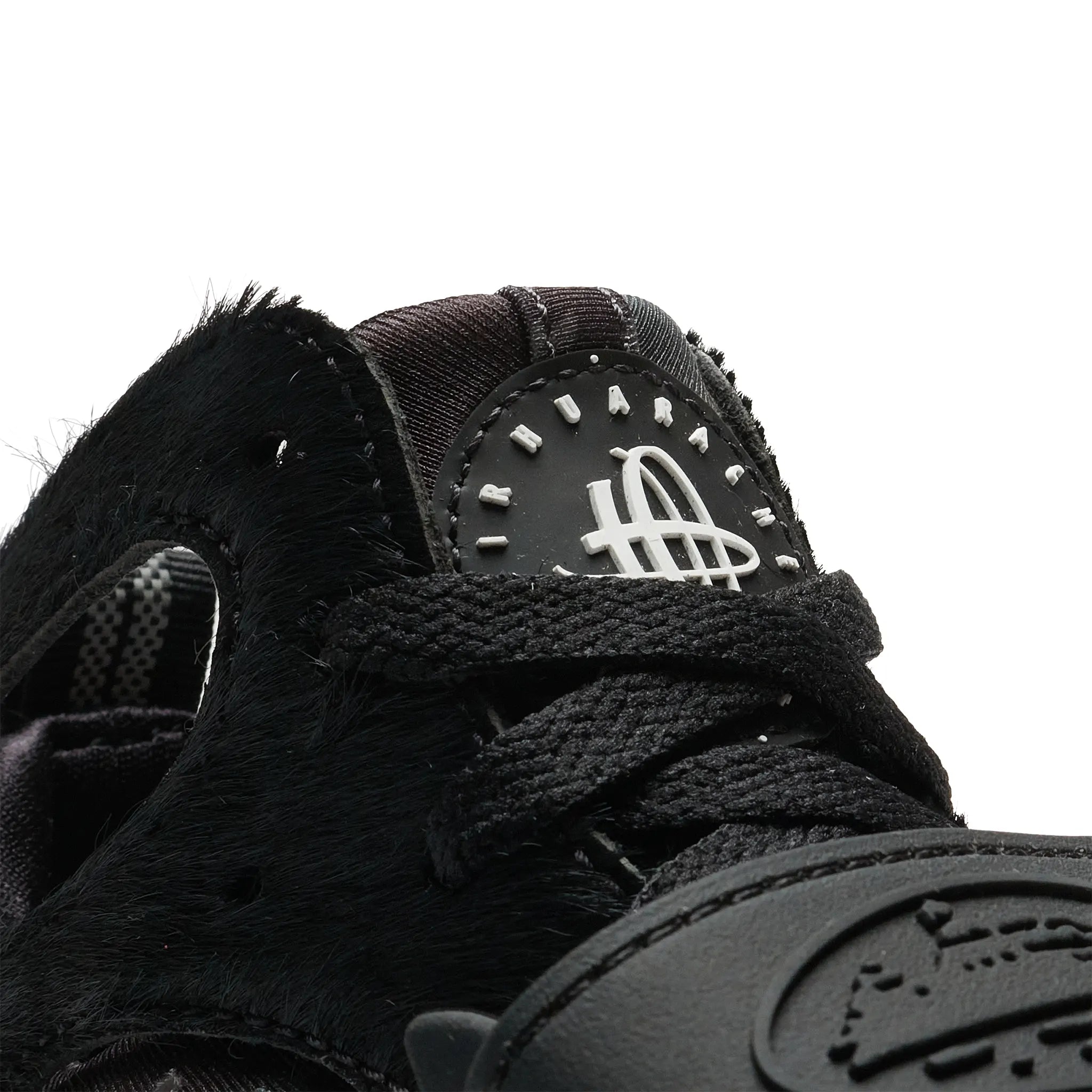 Tongue view of Corteiz x Nike Air Huarache Onyx FQ8793-003